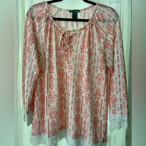 Lightweight knit type top with crochet trim.  Tie at neck.  Super cute